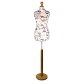 Black flower on cream Tailors Dummy with a Light Wood Round Stand and Thistle.