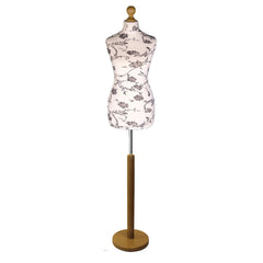 Black flower on cream Tailors Dummy with a Light Wood Round Stand and Thistle.